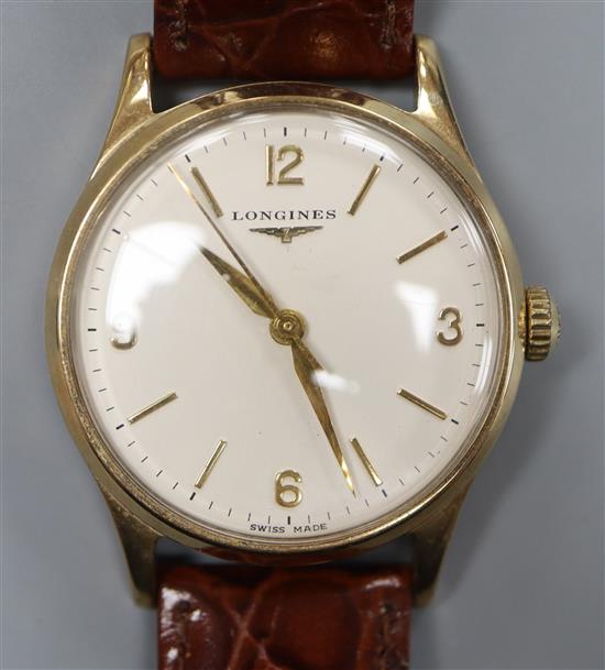 A gentlemans 1960s 9ct gold Longines manual wind wrist watch, with Arabic and baton numerals,